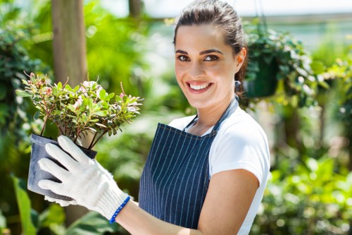 Workers in Hammersmith garden site preparing green waste for recycling